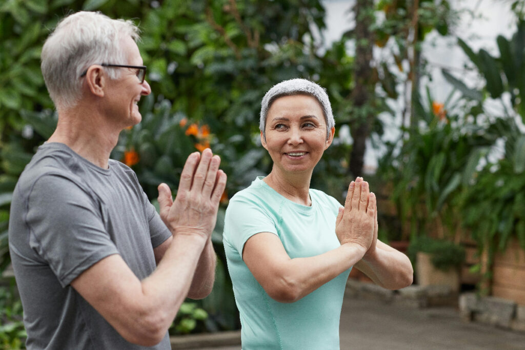 Couple enjoying yoga benefits of mind and body.